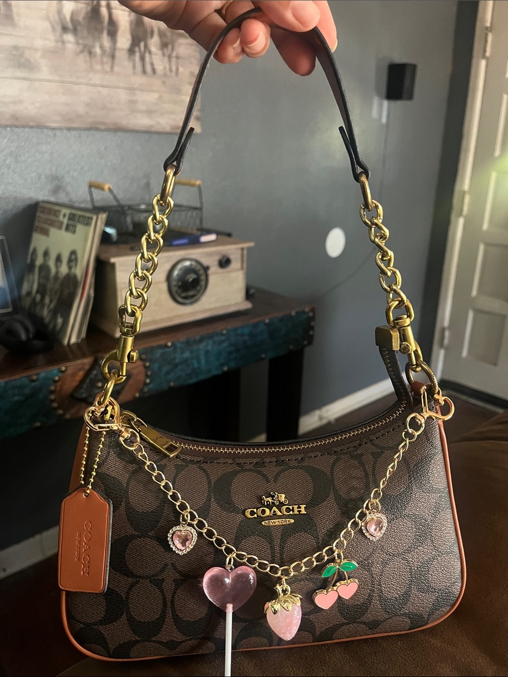 COACH Brown Signature Canvas Shoulder Bag with Pink Charm Accents